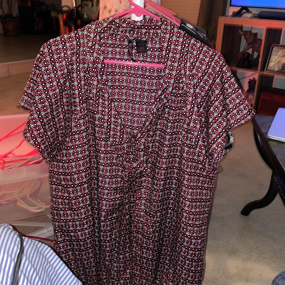 This super fun blouse is TORRID RETRO CHIC